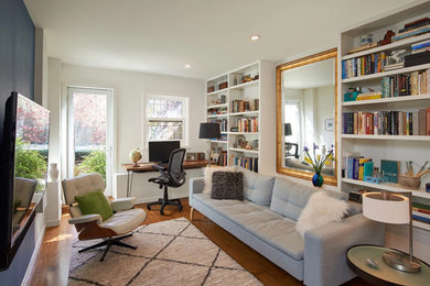 Example of a mid-sized transitional open concept medium tone wood floor and brown floor living room design in San Francisco with white walls, no fireplace and a wall-mounted tv