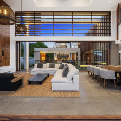 Living room - large contemporary open concept gray floor living room idea in Gold Coast - Tweed with white walls and a media wall