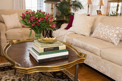 Medium sized traditional open plan living room in Boston with beige walls, medium hardwood flooring and a concealed tv.