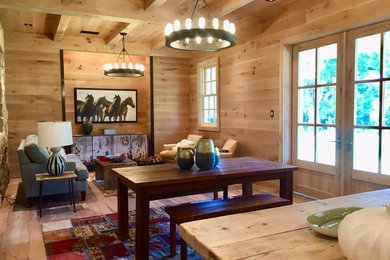 Example of a huge country open concept light wood floor living room design in Grand Rapids