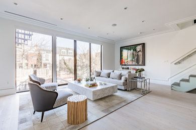 Living room - mid-sized modern open concept light wood floor and beige floor living room idea in DC Metro with white walls, no fireplace and no tv