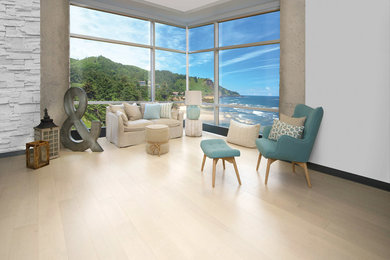 Inspiration for a coastal open concept light wood floor and beige floor living room remodel in Other with white walls