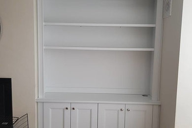 Alcove tv unit and radiator cabinet finished in pearl grey