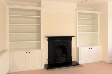 Inspiration for a small traditional enclosed living room in Surrey with a built-in media unit.