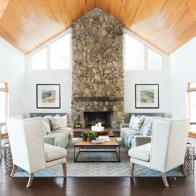 Cottage dark wood floor living room photo in Toronto with white walls, a standard fireplace and a stone fireplace