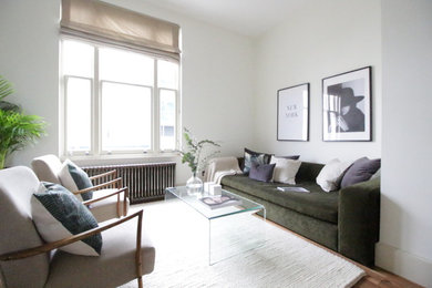 This is an example of a medium sized scandinavian living room in London.
