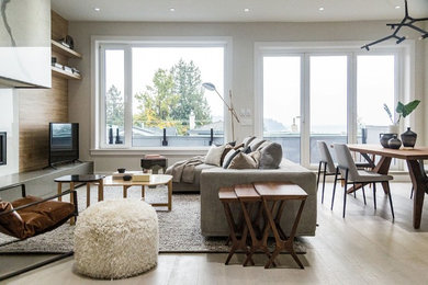 Living room - large contemporary open concept light wood floor and beige floor living room idea in Vancouver with gray walls, a ribbon fireplace, a tile fireplace and a tv stand