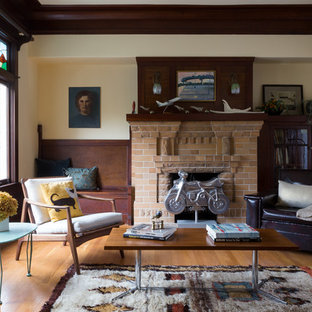 Mid-sized eclectic formal medium tone wood floor living room photo in San Francisco with a standard fireplace, white walls and a brick fireplace