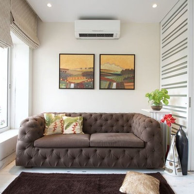 Mid-sized trendy enclosed marble floor living room photo in Mumbai with white walls and no fireplace