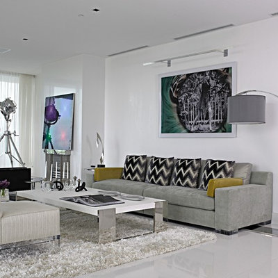 Inspiration for a large contemporary formal and open concept concrete floor and gray floor living room remodel in Miami with white walls, a standard fireplace, a plaster fireplace and no tv