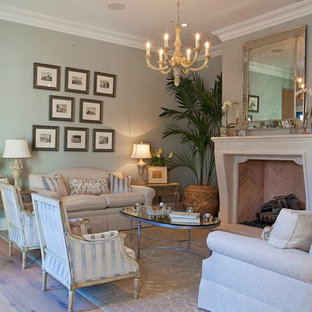 Mid-sized elegant formal and open concept light wood floor and beige floor living room photo in Phoenix with green walls, a standard fireplace, a stone fireplace and no tv