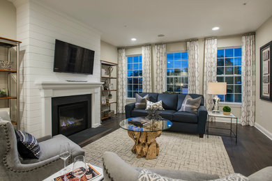 Mid-sized trendy open concept dark wood floor living room photo in Philadelphia with gray walls, a standard fireplace and a wall-mounted tv