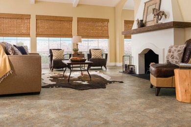 Mid-sized tuscan enclosed travertine floor and beige floor living room photo in Orange County with beige walls, a standard fireplace and a plaster fireplace