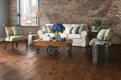 Inspiration for a large industrial formal and open concept dark wood floor and brown floor living room remodel in Cincinnati with brown walls and no tv