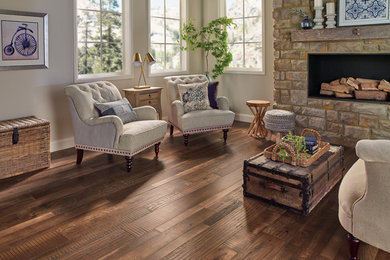 Inspiration for a timeless medium tone wood floor and brown floor living room remodel in Other
