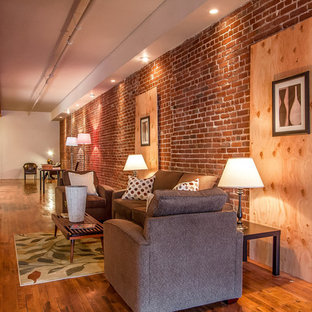 Living room - small industrial open concept and formal medium tone wood floor living room idea in Los Angeles with red walls, no fireplace and no tv