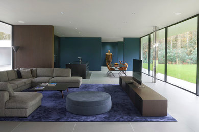 Inspiration for a contemporary open plan living room in London with no fireplace and a freestanding tv.
