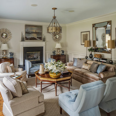 Large elegant formal and enclosed medium tone wood floor and brown floor living room photo in Other with beige walls, a standard fireplace, a stone fireplace and no tv