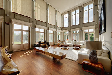 Living room - contemporary medium tone wood floor and brown floor living room idea in Montreal