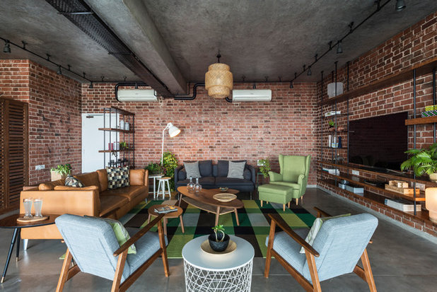 Industrial Family Room by The Crossboundaries