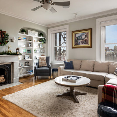 Example of a transitional living room design in Boston with a standard fireplace