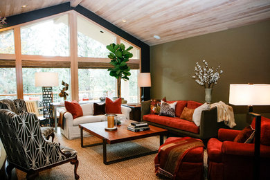 Large classic open plan living room in Other with green walls, medium hardwood flooring and a standard fireplace.