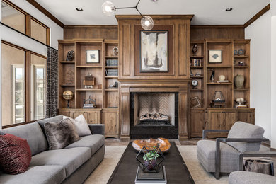 Example of a transitional living room library design in Phoenix with a standard fireplace