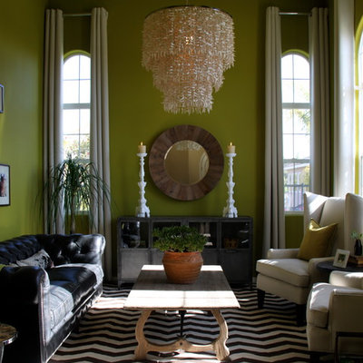 Inspiration for an eclectic living room remodel in Orange County with green walls