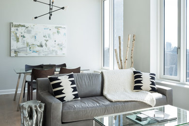 Inspiration for a mid-sized modern open concept living room remodel in New York with gray walls and a wall-mounted tv