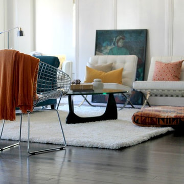Barcelona Chairs, Noguchi Coffee Table with Orange and Teal Color Scheme