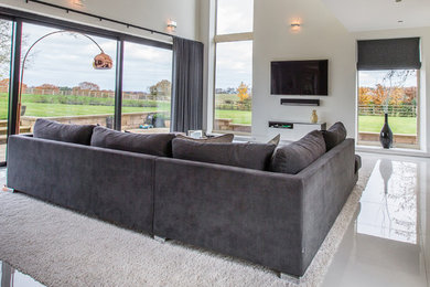 This is an example of a contemporary open plan living room in Other with white walls and slate flooring.