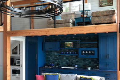 This is an example of a medium sized contemporary mezzanine living room in Other with blue walls, light hardwood flooring, no fireplace, no tv and beige floors.