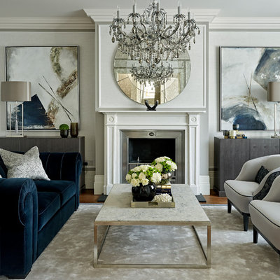 Living room - transitional formal and enclosed living room idea in London with no tv, a standard fireplace and gray walls