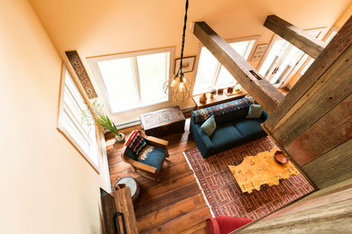 Living room - mid-sized eclectic medium tone wood floor living room idea in Detroit