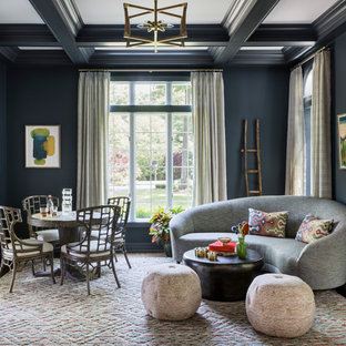 Example of an eclectic enclosed dark wood floor living room design in New York with blue walls