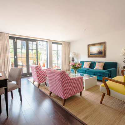Living room - mid-sized transitional open concept and formal dark wood floor and brown floor living room idea in London with white walls