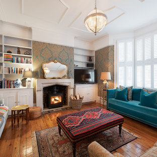 Inspiration for a medium sized classic living room in London with white walls, medium hardwood flooring, a wood burning stove and brown floors.