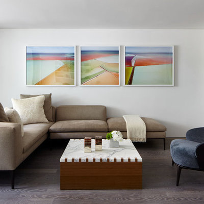 Small minimalist open concept brown floor and dark wood floor living room photo in New York with white walls and a wall-mounted tv
