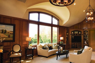Example of a large mountain style formal and open concept carpeted and beige floor living room design in Other with brown walls, no fireplace and a media wall