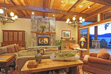 Living room - large rustic formal and enclosed medium tone wood floor and brown floor living room idea in Other with beige walls, a standard fireplace, a stone fireplace and no tv