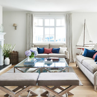 Inspiration for a nautical formal living room in Wiltshire with light hardwood flooring, a wood burning stove, no tv, beige floors and white walls.