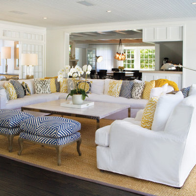 Example of a huge beach style formal and open concept dark wood floor living room design in New York with white walls and a standard fireplace