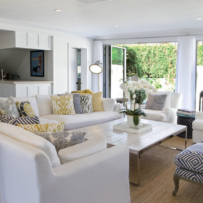 Living room - huge coastal formal and open concept dark wood floor living room idea in New York with white walls, a standard fireplace and a brick fireplace