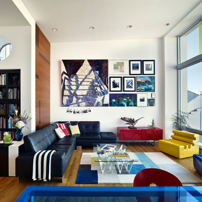 Example of a mid-sized eclectic formal and open concept medium tone wood floor living room design in San Francisco with white walls and no tv