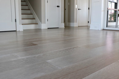 Inspiration for a coastal medium tone wood floor and gray floor living room remodel in Philadelphia