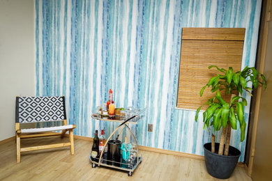 Living room - coastal wallpaper living room idea in St Louis