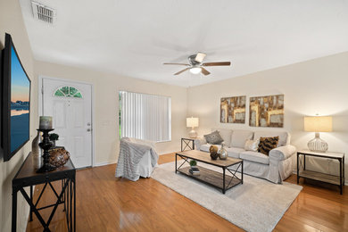 Example of a transitional living room design in Tampa
