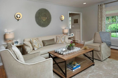 Living room - mid-sized transitional enclosed carpeted and beige floor living room idea in New York with gray walls