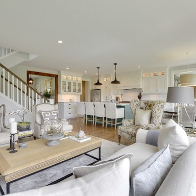 Inspiration for a cottage open concept medium tone wood floor living room remodel in Minneapolis with white walls