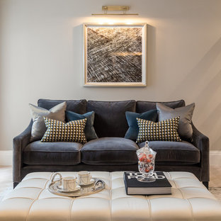 Photo of a contemporary living room in London with beige walls and light hardwood flooring.